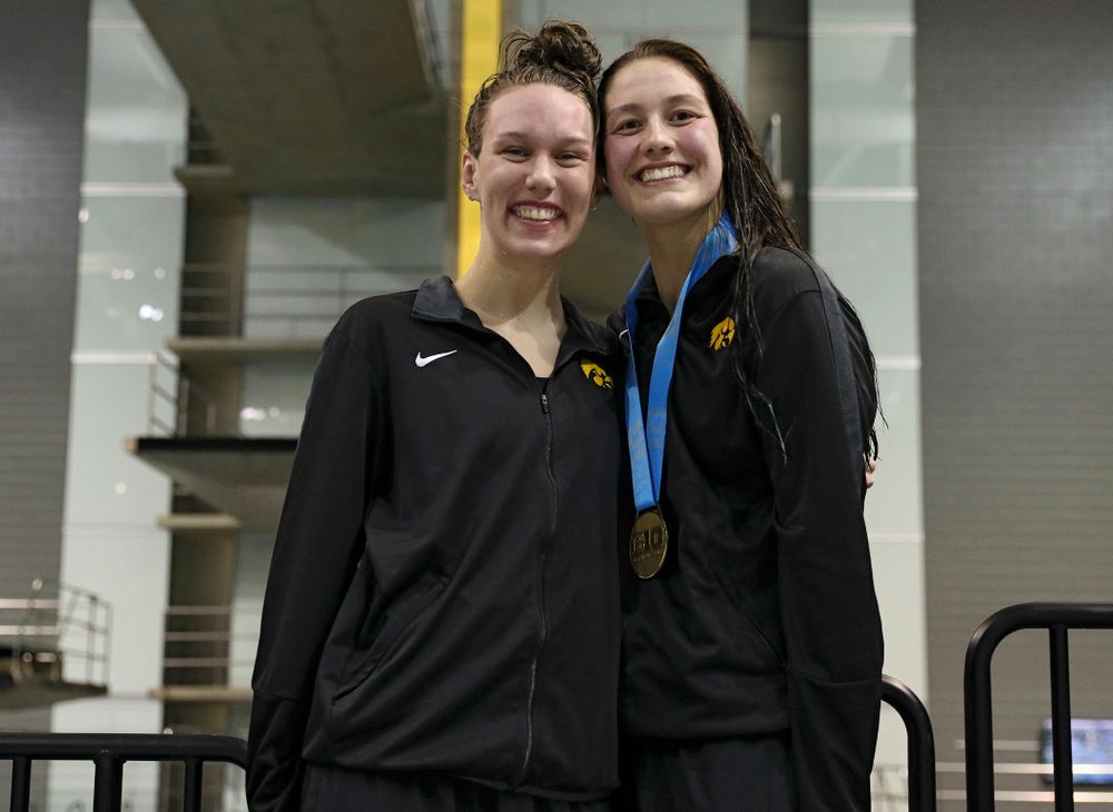 Iowa’s Allyssa Fluit (from left) and Hannah Burvill on the awards stand after swimming the women’s 200 yard freestyle final event during the 2020 Women’s Big Ten Swimming and Diving Championships at the Campus Recreation and Wellness Center in Iowa City on Friday, February 21, 2020. (Stephen Mally/hawkeyesports.com)