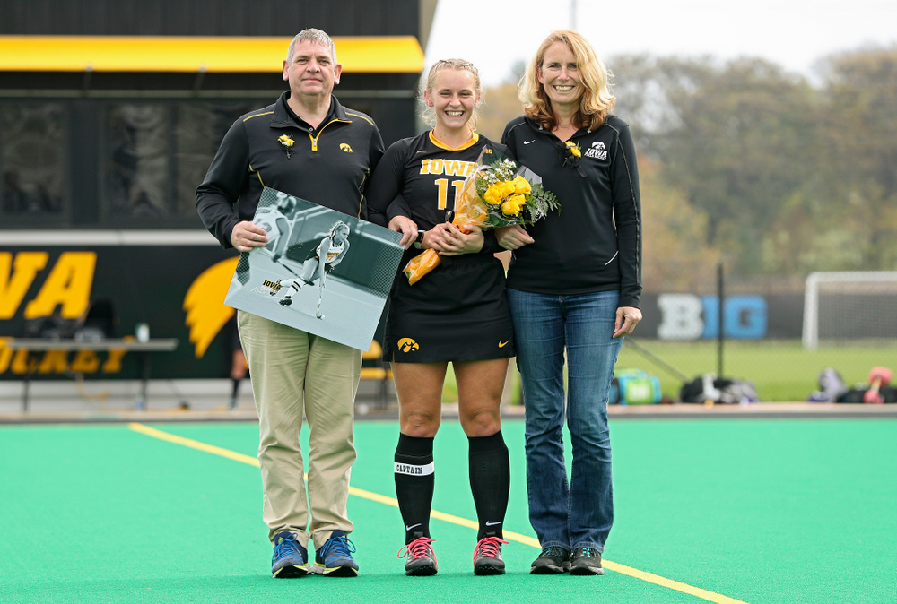 Iowa’s Katie Birch (11) in honored with her parents on Senior Day before their game at Grant Field in Iowa City on Saturday, Oct 26, 2019. (Stephen Mally/hawkeyesports.com)