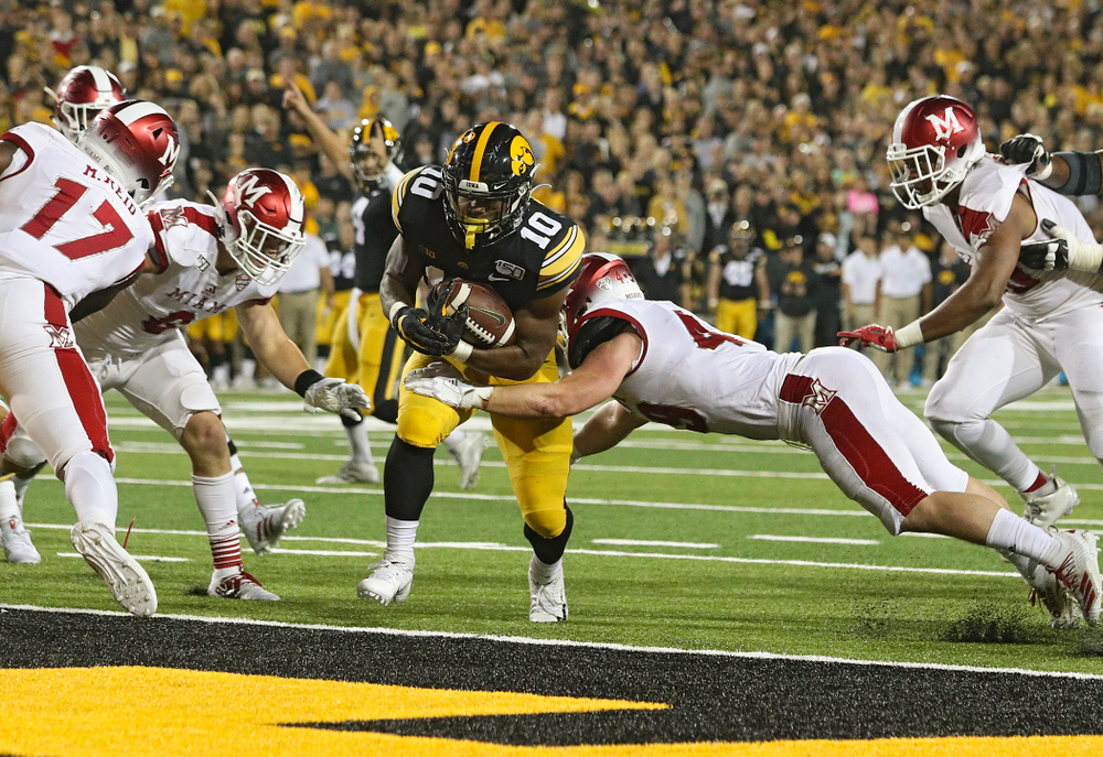 Iowa Hawkeyes running back Mekhi Sargent (10) scores a touchdown on a 2-yard run during the third quarter of their game at Kinnick Stadium in Iowa City on Saturday, Aug 31, 2019. (Stephen Mally/hawkeyesports.com)