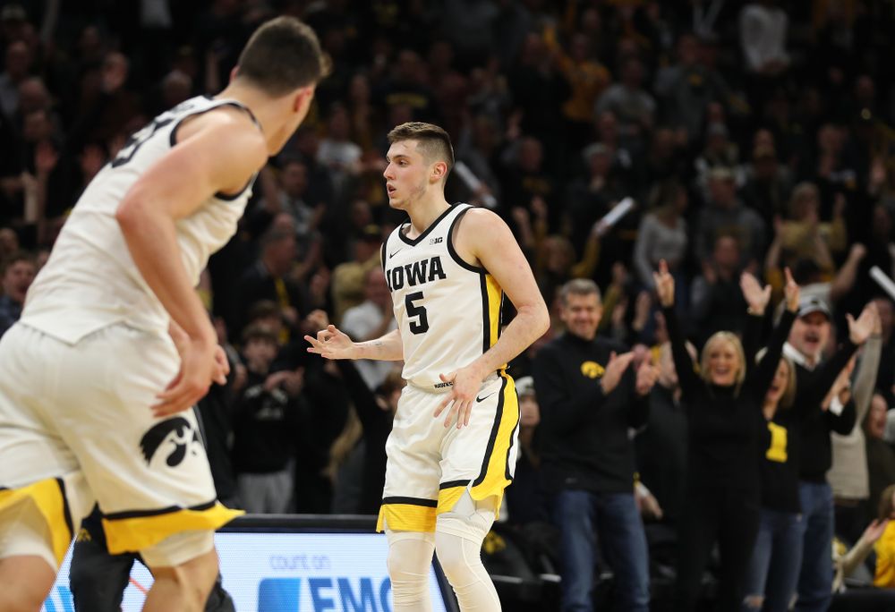 Iowa Hawkeyes guard CJ Fredrick (5) celebrates a three point basket against the Michigan Wolverines Friday, January 17, 2020 at Carver-Hawkeye Arena. (Brian Ray/hawkeyesports.com)