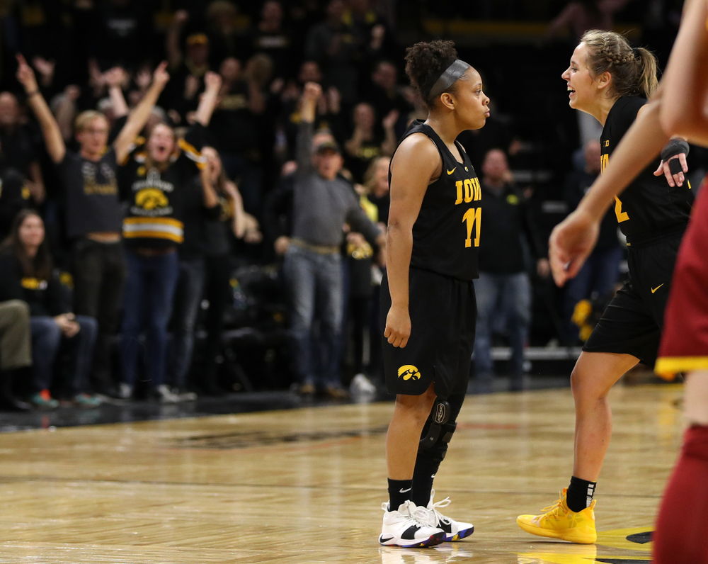 Iowa Hawkeyes guard Tania Davis (11) celebrates with guard Kathleen Doyle (22) after making the game winning three point basket against the Iowa State Cyclones in the Iowa Corn Cy-Hawk Series Wednesday, December 5, 2018 at Carver-Hawkeye Arena. (Brian Ray/hawkeyesports.com)