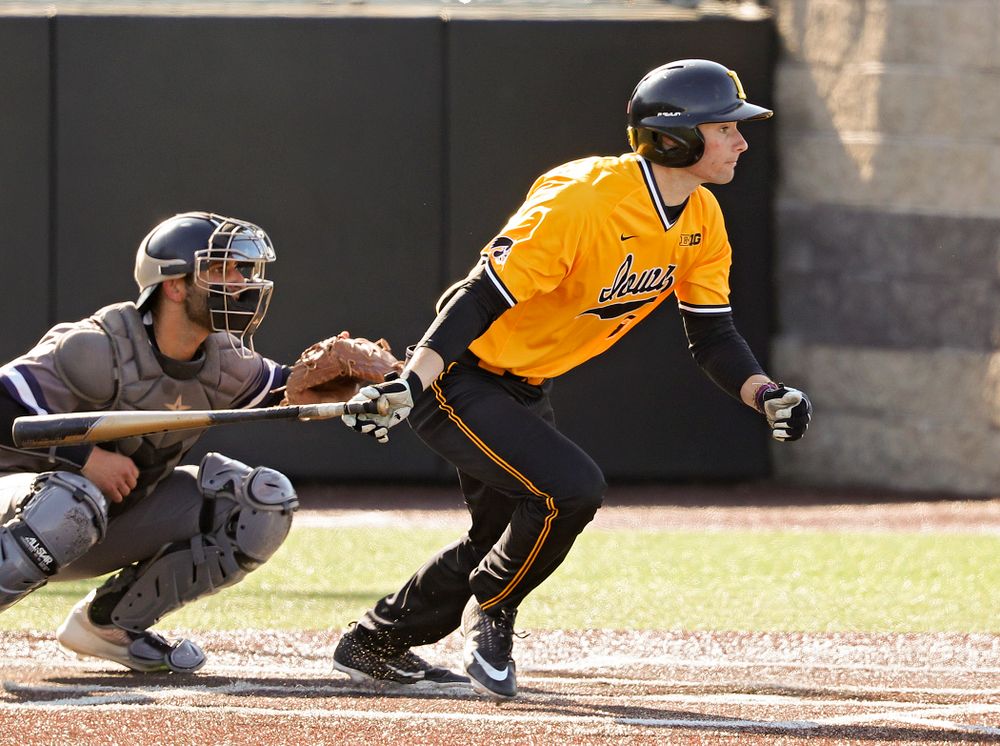 Iowa Hawkeyes center fielder Ben Norman (9) hits an RBI single during the first inning of their game at Duane Banks Field in Iowa City on Tuesday, Apr. 2, 2019. (Stephen Mally/hawkeyesports.com)