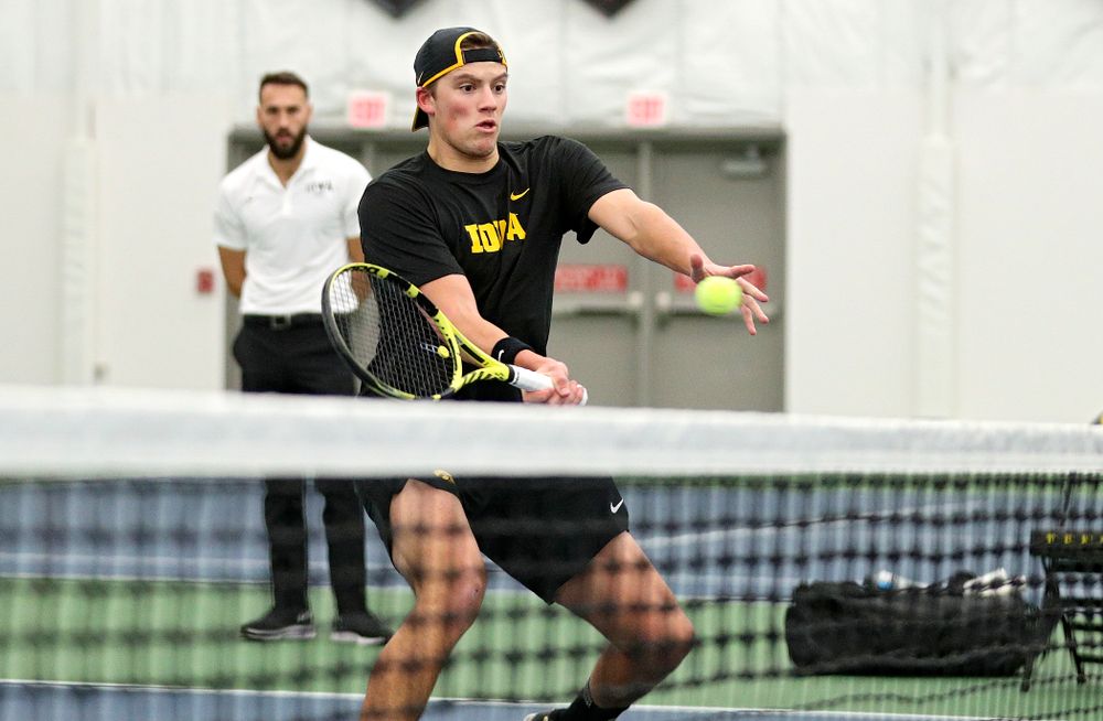 Iowa’s Joe Tyler returns a shot during his doubles match at the Hawkeye Tennis and Recreation Complex in Iowa City on Thursday, January 16, 2020. (Stephen Mally/hawkeyesports.com)