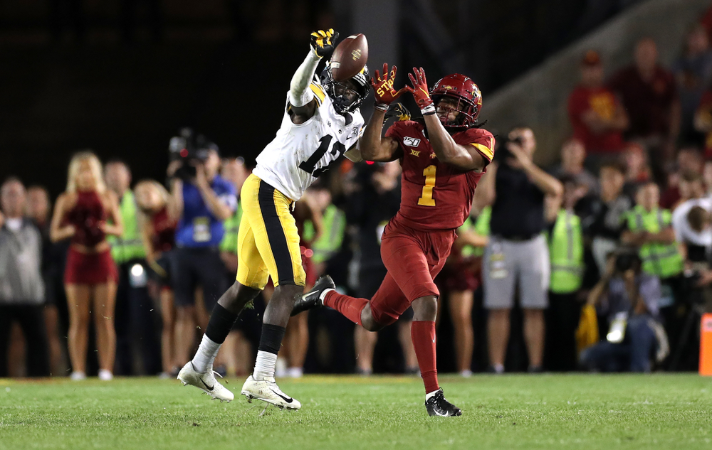 Iowa Hawkeyes defensive back D.J. Johnson (12) breaks up a pass against the Iowa State Cyclones Saturday, September 14, 2019 in Ames, Iowa. (Brian Ray/hawkeyesports.com)
