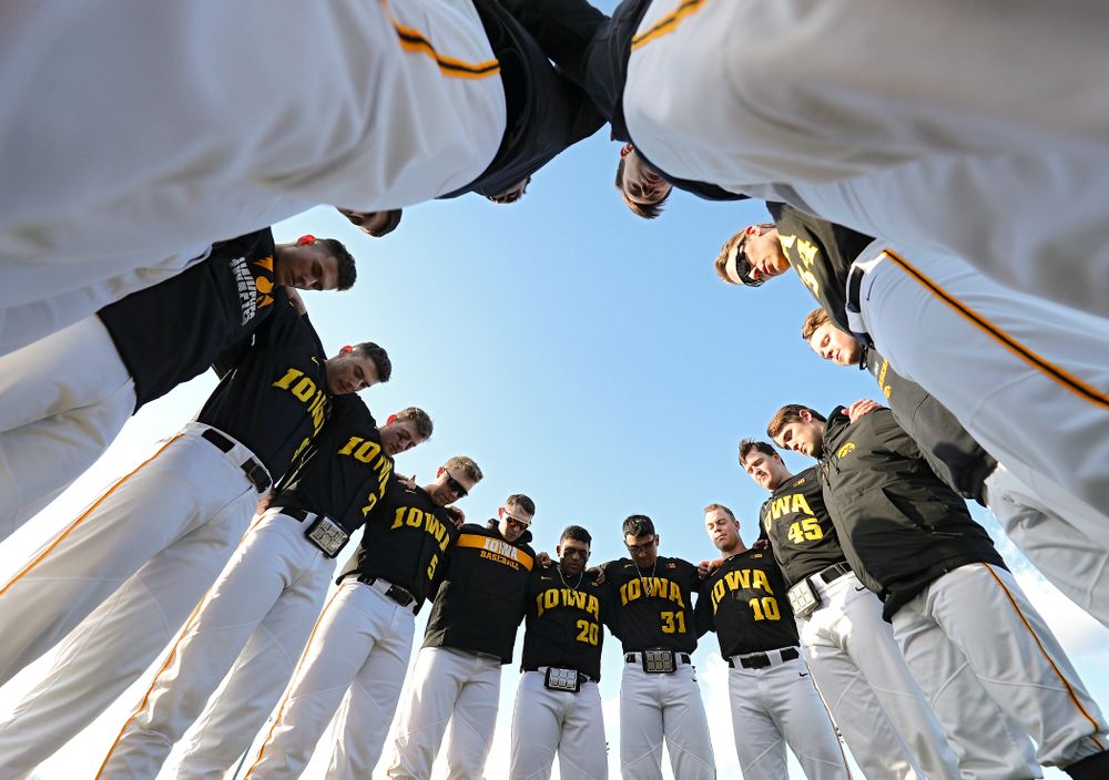 The Hawkeyes huddle before their game at Duane Banks Field in Iowa City on Tuesday, March 3, 2020. (Stephen Mally/hawkeyesports.com)
