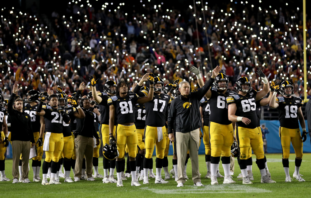 The Iowa Hawkeyes wave to the Stead Family ChildrenÕs Hospital at the end of the first quarter against USC in the Holiday Bowl Friday, December 27, 2019 at San Diego Community Credit Union Stadium. (Brian Ray/hawkeyesports.com)