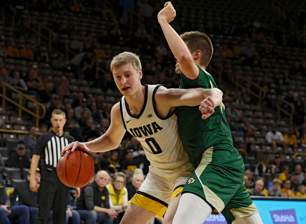 Iowa Hawkeyes forward Michael Baer (0) drives with the ball during the second half of their game at Carver-Hawkeye Arena in Iowa City on Sunday, Nov 24, 2019. (Stephen Mally/hawkeyesports.com)