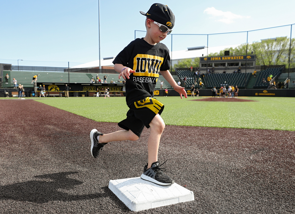 Kids run the bases after Iowa's game against UC Irvine at Duane Banks Field in Iowa City on Sunday, May. 5, 2019. (Stephen Mally/hawkeyesports.com)