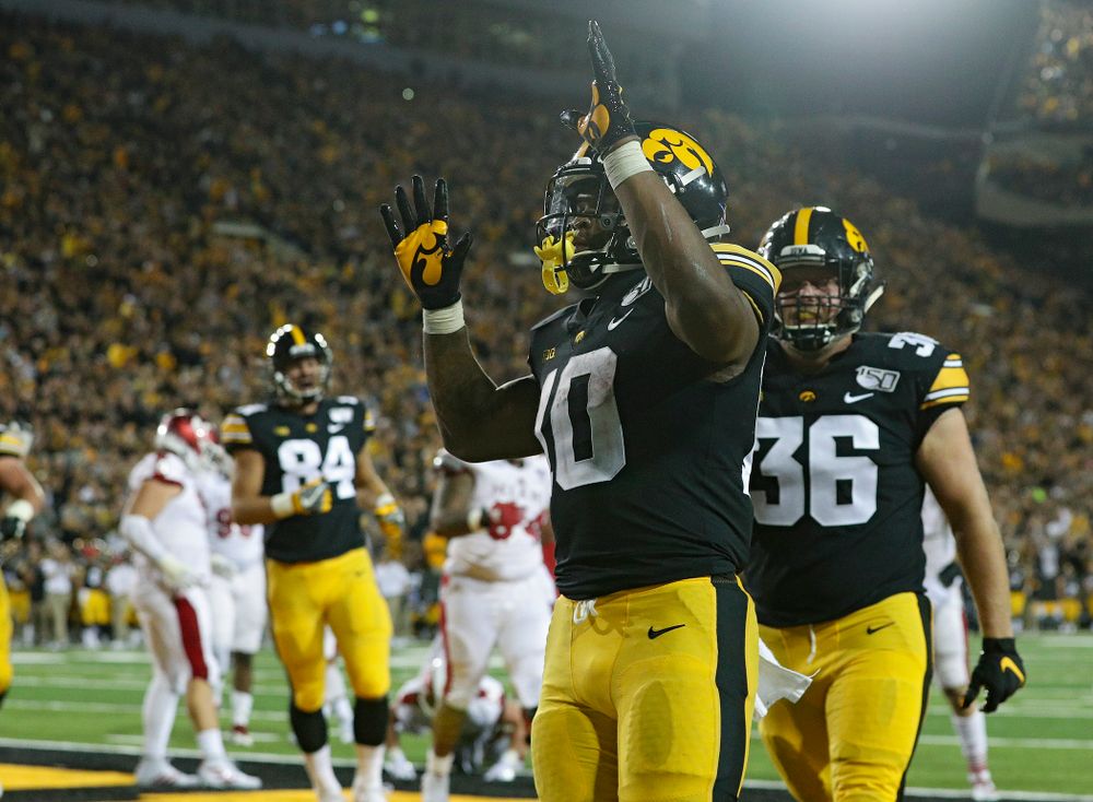 Iowa Hawkeyes running back Mekhi Sargent (10) celebrates after scoring a touchdown on a 2-yard run during the third quarter of their game at Kinnick Stadium in Iowa City on Saturday, Aug 31, 2019. (Stephen Mally/hawkeyesports.com)