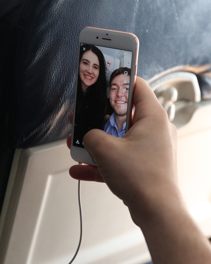 Iowa Hawkeyes forward Megan Gustafson (10) takes selfies with the band and spirit squad on board the team plane to Greensboro, NC for the Regionals of the 2019 NCAA Women's Basketball Championships Thursday, March 28, 2019 at the Eastern Iowa Airport. (Brian Ray/hawkeyesports.com)