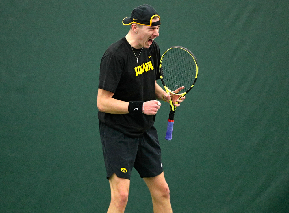 Iowa’s Nikita Snezhko celebrates a point during his singles match at the Hawkeye Tennis and Recreation Complex in Iowa City on Friday, February 14, 2020. (Stephen Mally/hawkeyesports.com)