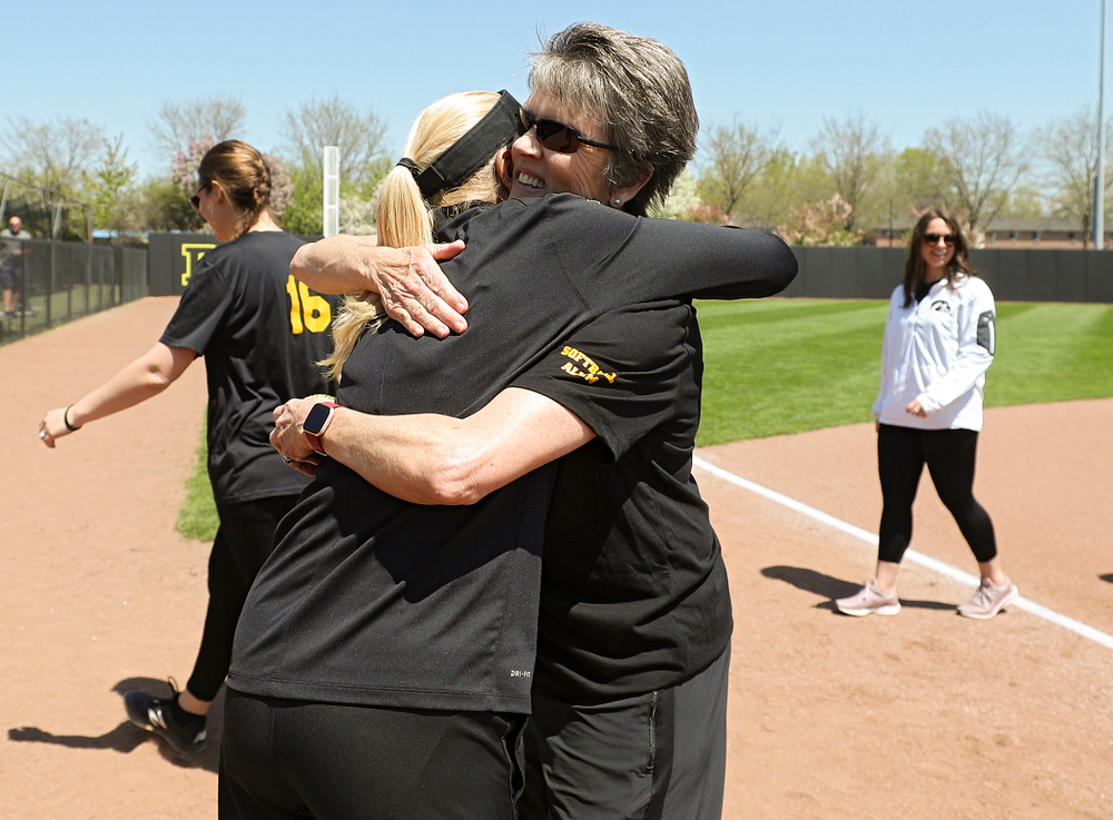 Former Iowa head coach Gayle Blevins (right) gives current head coach Renee Gillispie a hug before the game against Ohio State at Pearl Field in Iowa City on Saturday, May. 4, 2019. (Stephen Mally/hawkeyesports.com)