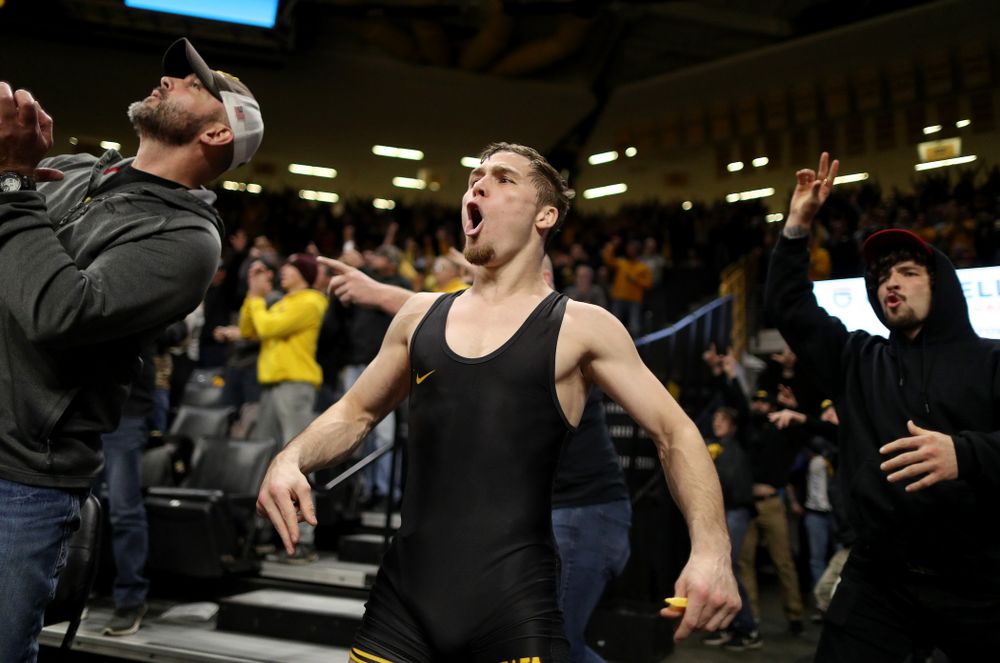 IowaÕs Spencer Lee cheers on teammate Austin DeSanto as he wrestles WisconsinÕs Seth Gross at 133 pounds Sunday, December 1, 2019 at Carver-Hawkeye Arena. DeSanto won the match 6-2. (Brian Ray/hawkeyesports.com)