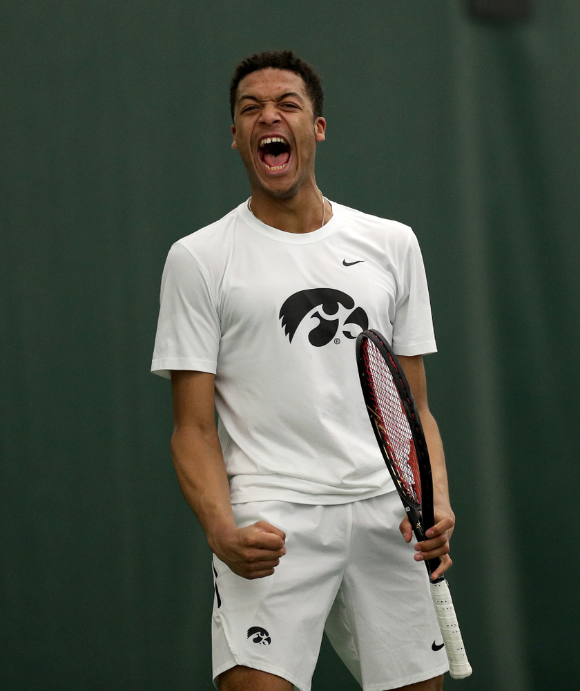 Iowa’s Will Davies and Oliver Okonkwo celebrates a point against Cornell Sunday, March 8, 2020 at the Hawkeye Tennis and Recreation Center. (Brian Ray/hawkeyesports.com)