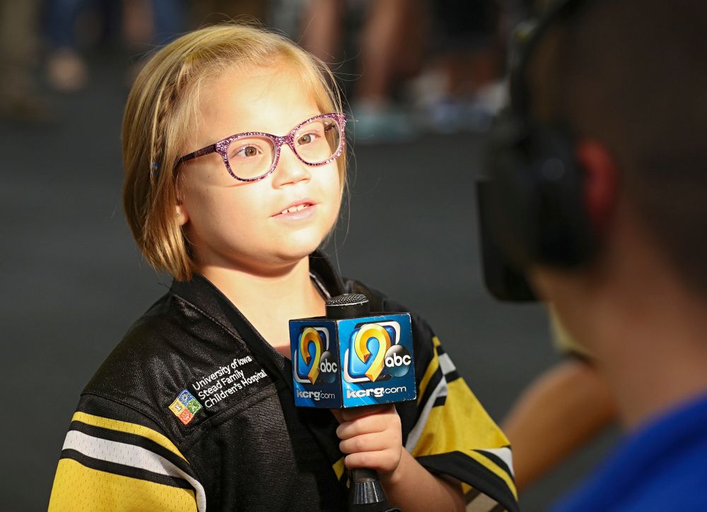Kid Captain Gabby Yoder is interviewed in the Iowa locker room during Kids Day at Kinnick Stadium in Iowa City on Saturday, Aug 10, 2019. (Stephen Mally/hawkeyesports.com)