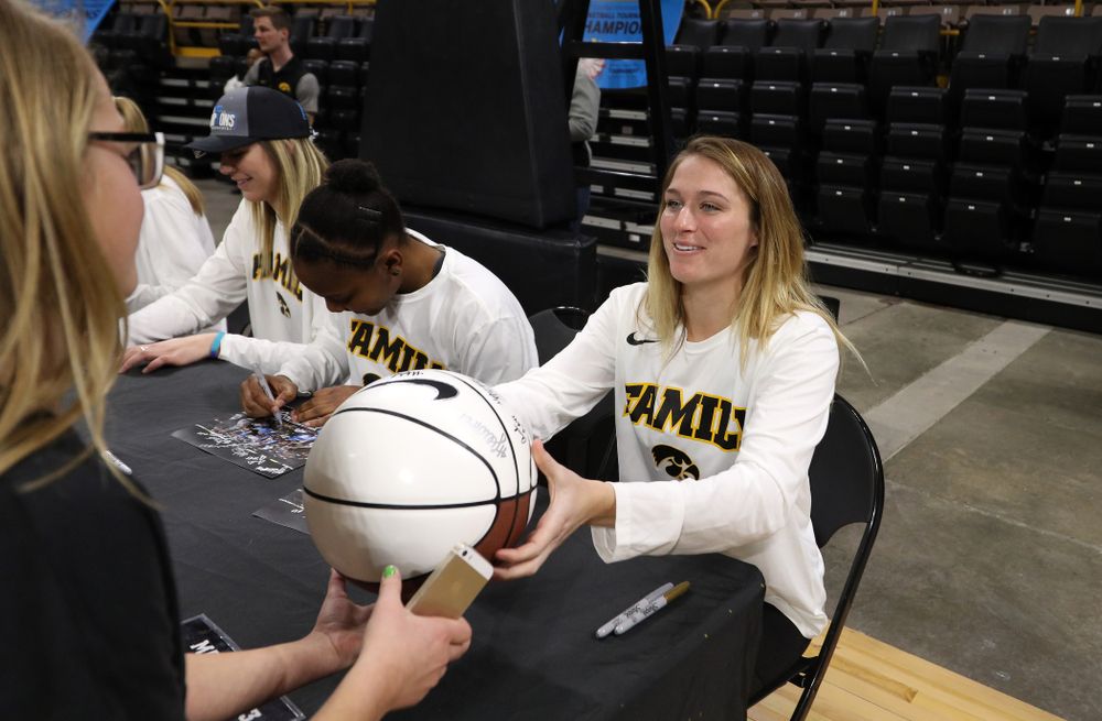 Iowa Hawkeyes guard Makenzie Meyer (3) signs autographs during a celebration of their Big Ten Women's Basketball Tournament championship Monday, March 18, 2019 at Carver-Hawkeye Arena. (Brian Ray/hawkeyesports.com)