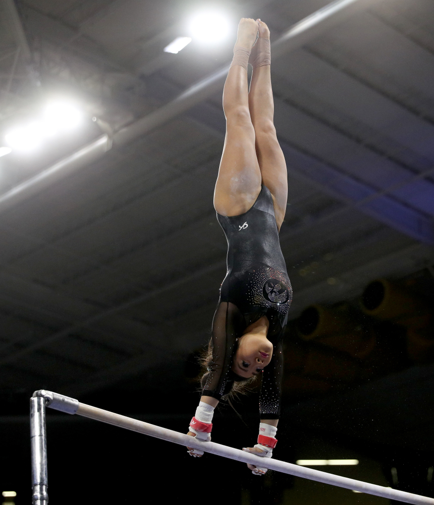 Iowa’s Clair Kaji competes on the bars against Michigan Friday, February 14, 2020 at Carver-Hawkeye Arena. (Brian Ray/hawkeyesports.com)