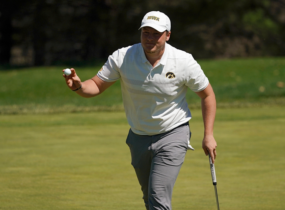 Iowa's Alex Schaake holds up his ball after finishing his first round of the Hawkeye Invitational at Finkbine Golf Course in Iowa City on Saturday, Apr. 20, 2019. (Stephen Mally/hawkeyesports.com)