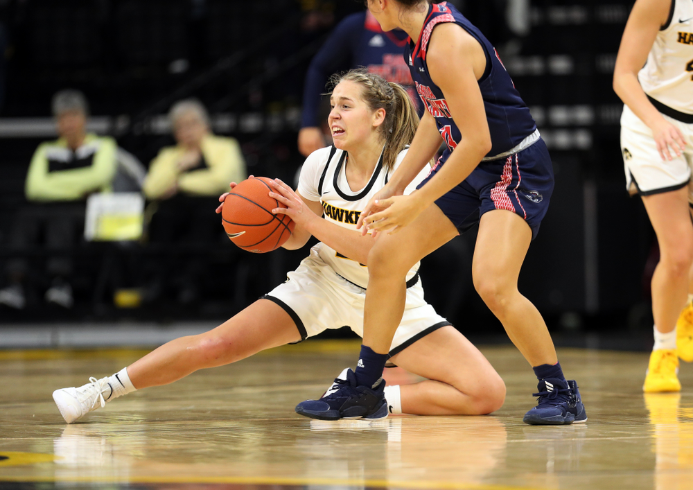 Iowa Hawkeyes guard Kathleen Doyle (22) steals the ball against Florida Atlantic University Thursday, November 7, 2019 at Carver-Hawkeye Arena. (Brian Ray/hawkeyesports.com)