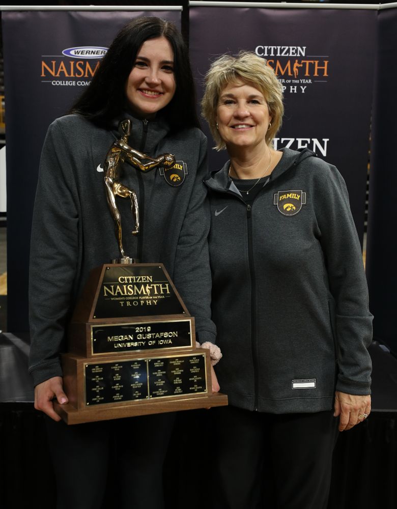 Iowa Hawkeyes forward Megan Gustafson (10) and head coach Lisa Bluder with the Naismith Player Of The Year Trophy during the teamÕs Celebr-Eight event Wednesday, April 24, 2019 at Carver-Hawkeye Arena. (Brian Ray/hawkeyesports.com)