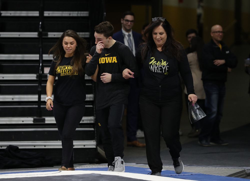 Iowa Men's Gymnast Jake Brodarzon and his family during senior day ceremonies following their meet against the Ohio State Buckeyes Saturday, March 16, 2019 at Carver-Hawkeye Arena. (Brian Ray/hawkeyesports.com)