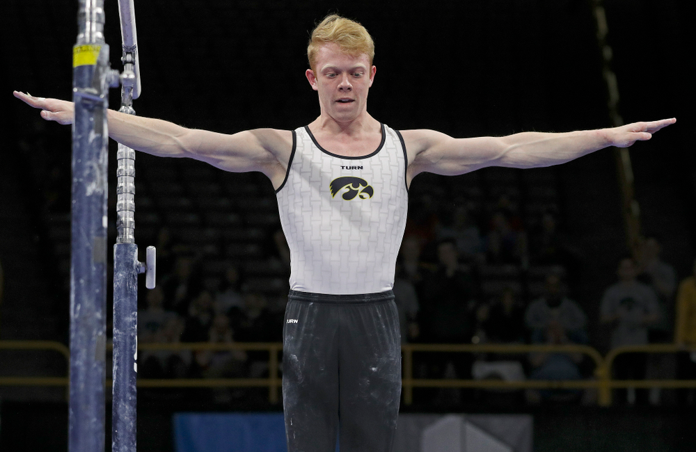 Iowa's Nick Merryman competes in the parallel bars during the second day of the Big Ten Men's Gymnastics Championships at Carver-Hawkeye Arena in Iowa City on Saturday, Apr. 6, 2019. (Stephen Mally/hawkeyesports.com)
