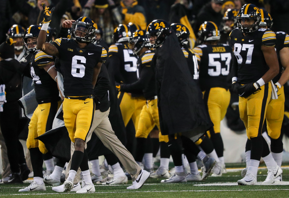 Iowa Hawkeyes wide receiver Ihmir Smith-Marsette (6) signals for a first down after a replay review reversed the call on the field during a game against Northwestern at Kinnick Stadium on November 10, 2018. (Tork Mason/hawkeyesports.com)