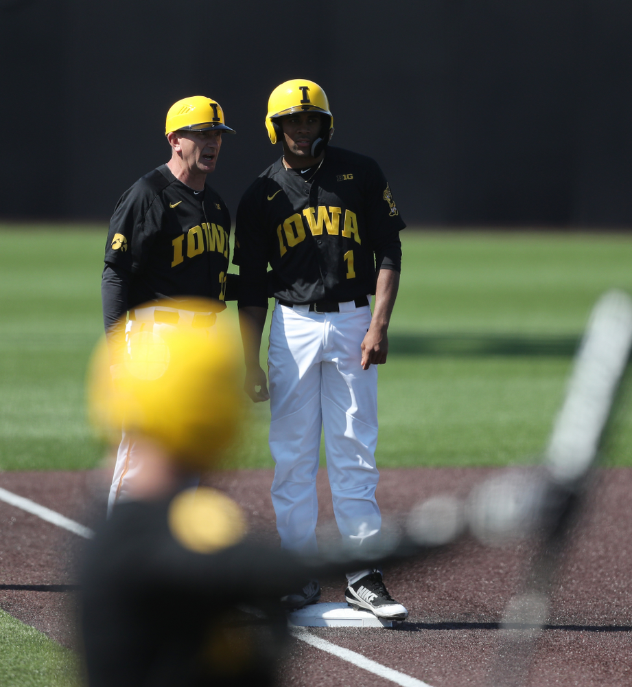 Iowa Hawkeyes infielder Lorenzo Elion (1) and head coach Rick Heller during game two against UC Irvine Saturday, May 4, 2019 at Duane Banks Field. (Brian Ray/hawkeyesports.com)