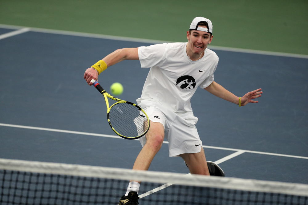 Iowa’ Nikita Snezhko plays a shot against Cornell Sunday, March 8, 2020 at the Hawkeye Tennis and Recreation Center. (Brian Ray/hawkeyesports.com)