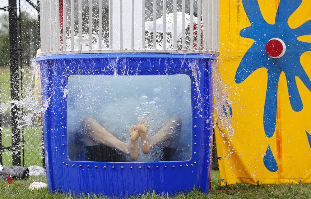 Iowa assistant strength and conditioning coach Cody Roberts drops into the water in the dunk tank during the Student-Athlete Kickoff outside the Karro Athletics Hall of Fame Building in Iowa City on Sunday, Aug 25, 2019. (Stephen Mally/hawkeyesports.com)