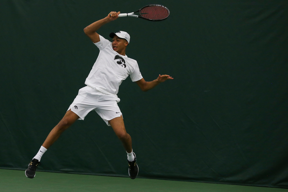 Iowa’s Oliver Okonkwo hits a forehand during the Iowa men’s tennis match vs Western Michigan on Saturday, January 18, 2020 at the Hawkeye Tennis and Recreation Complex. (Lily Smith/hawkeyesports.com)