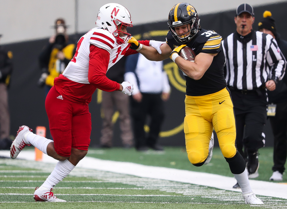 Iowa Hawkeyes tight end T.J. Hockenson (38) runs the ball during a game against Nebraska at Kinnick Stadium on November 23, 2018. (Tork Mason/hawkeyesports.com)