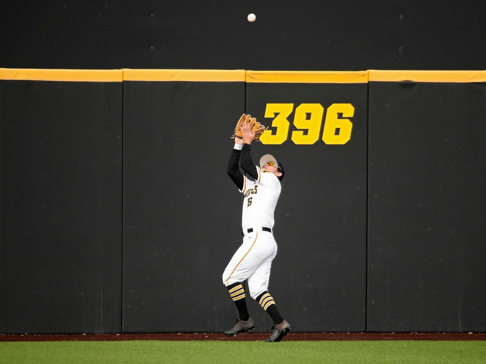 Iowa outfielder Justin Jenkins (6) runs down a fly ball for an out during the eighth inning of their college baseball game at Duane Banks Field in Iowa City on Wednesday, March 11, 2020. (Stephen Mally/hawkeyesports.com)