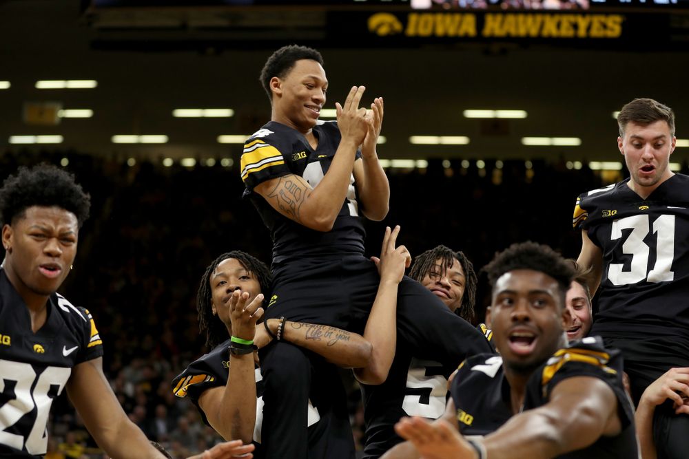 Members of the Hawkeye Football team performs with the Iowa Dance Team at halftime of the Iowa Hawkeyes game against the Ohio State Buckeyes Thursday, February 20, 2020 at Carver-Hawkeye Arena. (Brian Ray/hawkeyesports.com)