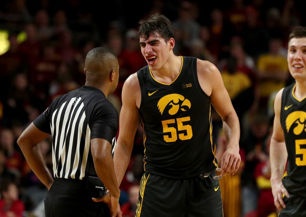 Iowa Hawkeyes forward Luka Garza (55) shows off his broken teeth to an official during their game against the Iowa State Cyclones Thursday, December 12, 2019 at Hilton Coliseum in Ames, Iowa(Brian Ray/hawkeyesports.com)
