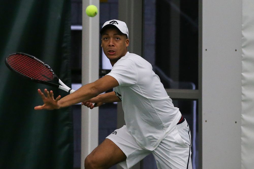 Iowa’s Oliver Okonkwo hits a forehand during the Iowa men’s tennis match vs Western Michigan on Saturday, January 18, 2020 at the Hawkeye Tennis and Recreation Complex. (Lily Smith/hawkeyesports.com)