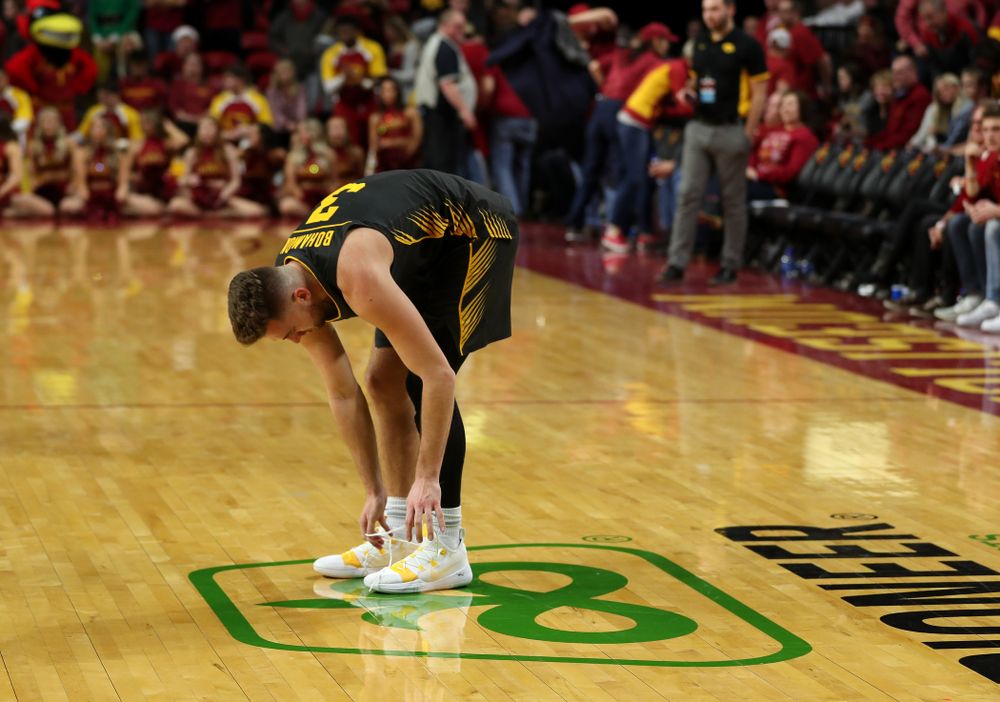 Iowa Hawkeyes guard Jordan Bohannon (3) unties his shoes following their game against the Iowa State Cyclones Thursday, December 12, 2019 at Hilton Coliseum in Ames, Iowa(Brian Ray/hawkeyesports.com)