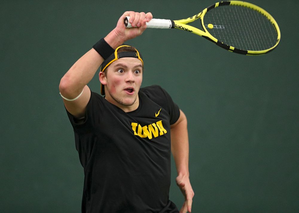 Iowa’s Joe Tyler hits a shot during his match against Marquette at the Hawkeye Tennis and Recreation Complex in Iowa City on Saturday, January 25, 2020. (Stephen Mally/hawkeyesports.com)