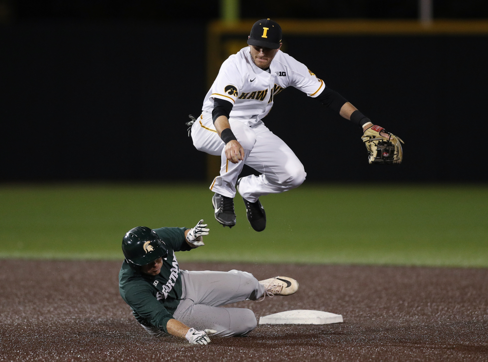 Iowa Hawkeyes Tanner Wetrich (16) turns a double play against the Michigan State Spartans Friday, May 10, 2019 at Duane Banks Field. (Brian Ray/hawkeyesports.com)