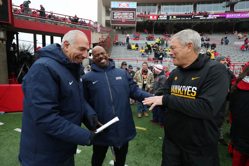 Iowa Hawkeyes head coach Kirk Ferentz talks with BTNÕs Howard Griffith and Gerry DiNardo before their game against the Nebraska Cornhuskers Friday, November 29, 2019 at Memorial Stadium in Lincoln, Neb. (Brian Ray/hawkeyesports.com)