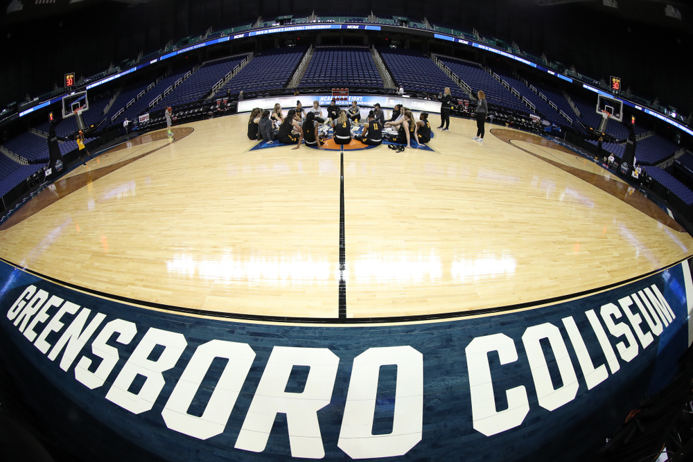 The Iowa Hawkeyes talk in their circle during shoot around before their regional final against the Baylor Lady Bears in the 2019 NCAA Women's College Basketball Tournament Monday, April 1, 2019 at Greensboro Coliseum in Greensboro, NC.(Brian Ray/hawkeyesports.com)