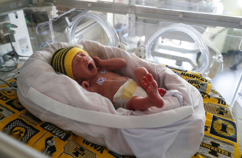 Iowa Hawkeyes offensive lineman Dalton Ferguson (76) and his girlfriend Rachael stand with their newborn twins Ella and Hazel Wednesday, September 12, 2018 in the NICU at the Stead Family Children's Hospital (Brian Ray/hawkeyesports.com)