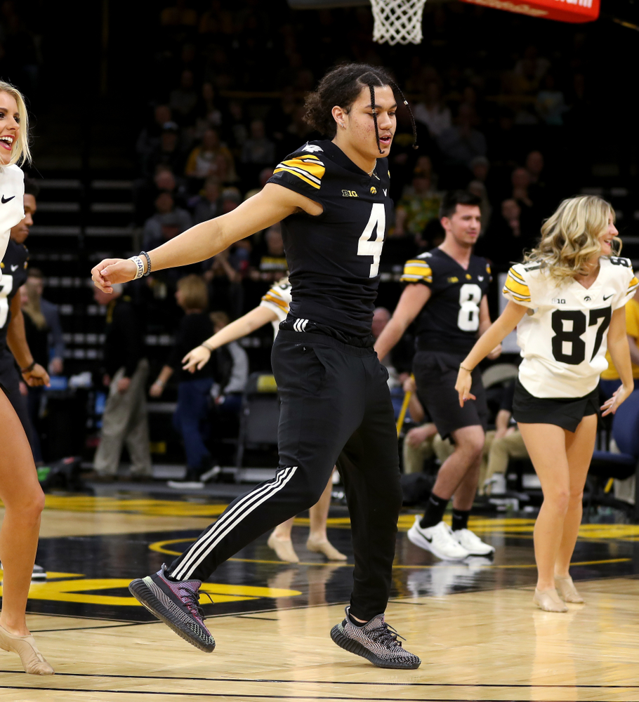Members of the Hawkeye Football team performs with the Iowa Dance Team at halftime of the Iowa Hawkeyes game against the Ohio State Buckeyes Thursday, February 20, 2020 at Carver-Hawkeye Arena. (Brian Ray/hawkeyesports.com)