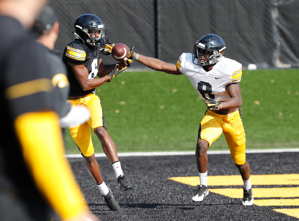 Iowa Hawkeyes wide receiver Ihmir Smith-Marsette (6) and defensive back Matt Hankins (8) during camp practice No. 17 Wednesday, August 22, 2018 at the Kenyon Football Practice Facility. (Brian Ray/hawkeyesports.com)