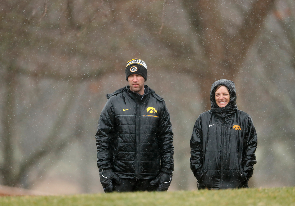 Iowa Men's Golf Head Coach Tyler Stith and Women's Golf Head Coach Megan Menzel watch the action during day two of the 2018 Hawkeye Invitational Friday, April 13, 2018 at Finkbine Golf Course. (Brian Ray/hawkeyesports.com)