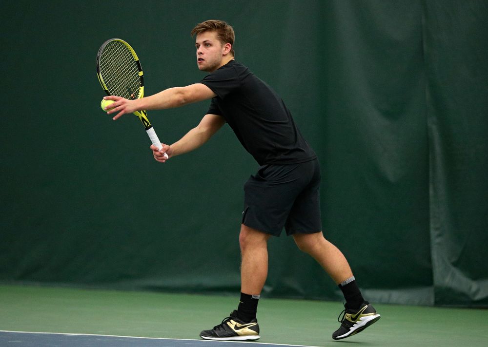 Iowa’s Will Davies serves during his singles match at the Hawkeye Tennis and Recreation Complex in Iowa City on Friday, March 6, 2020. (Stephen Mally/hawkeyesports.com)