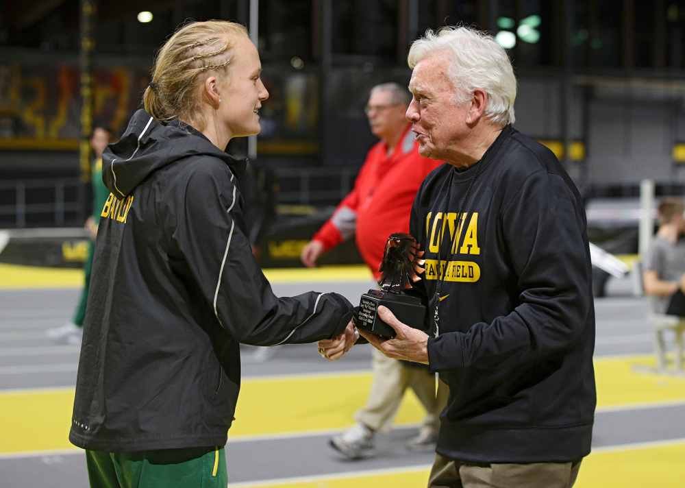 Larry Wieczorek hands out an award during the Larry Wieczorek Invitational at the Recreation Building in Iowa City on Saturday, January 18, 2020. (Stephen Mally/hawkeyesports.com)