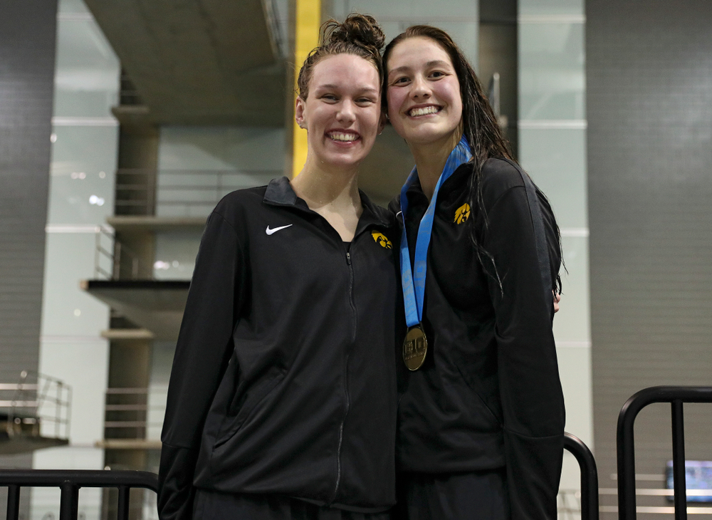 Iowa’s Allyssa Fluit (from left) and Hannah Burvill on the awards stand after swimming the women’s 200 yard freestyle final event during the 2020 Women’s Big Ten Swimming and Diving Championships at the Campus Recreation and Wellness Center in Iowa City on Friday, February 21, 2020. (Stephen Mally/hawkeyesports.com)