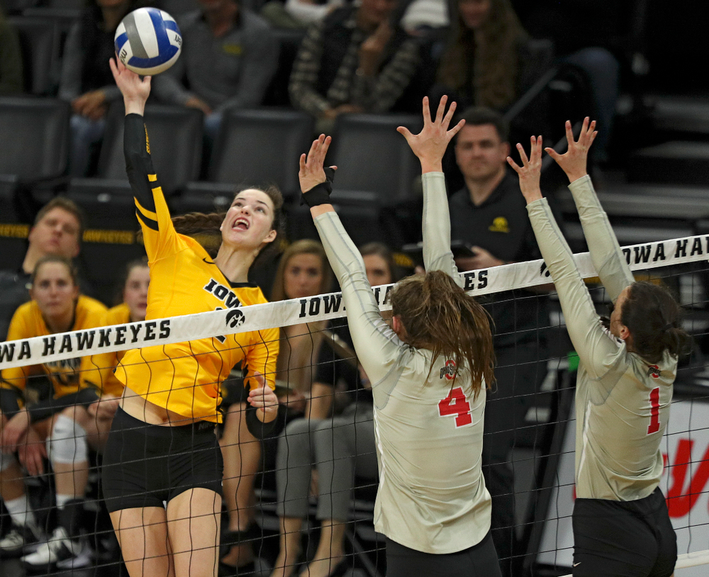 Iowa’s Courtney Buzzerio (2) gets up for a kill during the second set of their match at Carver-Hawkeye Arena in Iowa City on Friday, Nov 29, 2019. (Stephen Mally/hawkeyesports.com)