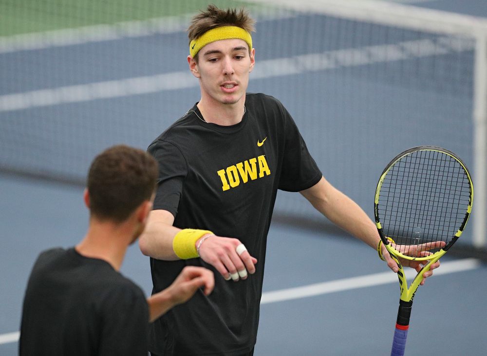 Iowa’s Nikita Snezhko (right) and Kareem Allaf celebrate a point during their doubles match against Marquette at the Hawkeye Tennis and Recreation Complex in Iowa City on Saturday, January 25, 2020. (Stephen Mally/hawkeyesports.com)